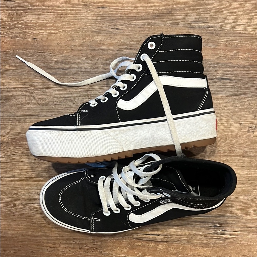 Vans women’s Platform Black and White High-Top Sneakers